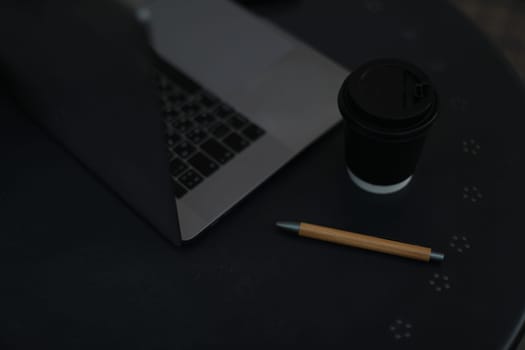 Pen and laptop. Inspiration moment,workspace or coffee break in the morning. selective focus.