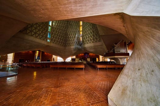 Image of Close up view of support beam with pews and ceiling of Cathedral of Saint Mary of the Assumption