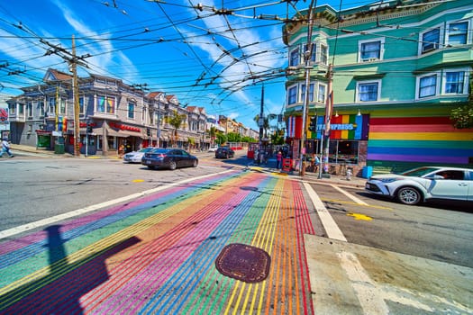 Image of Bright and vibrant rainbow crosswalks in Castro District with storefronts