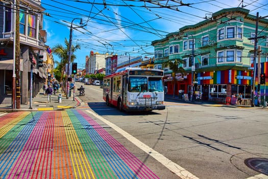 Image of 35 Bus crossing over rainbow crosswalk near Gyro Xpress in San Francisco