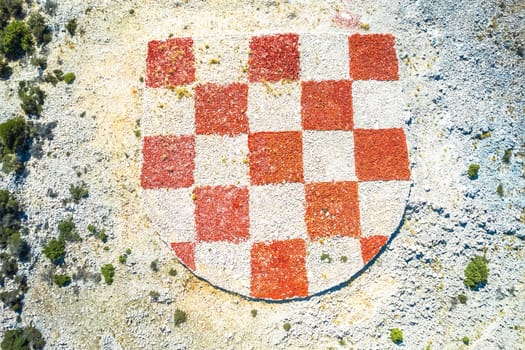 Rab island gigantic coat of arms of Croatia in stone desert near Lopar aerial view, archipelago of Croatia