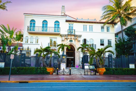 Miami Beach, USA, March 30 2022: Miami Beach South Beach Versace mansion street view at sunset. Famous ocean drive architecture view. Florida, USA