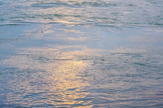 orange sunset on the sea, the setting sun is reflected in the water. High quality photo