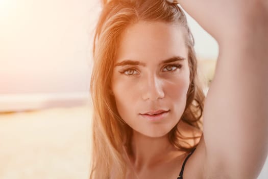 Happy woman portrait in cafe. Boho chic fashion style. Outdoor photo of young happy woman with long hair, sunny weather outdoors sitting in modern cafe