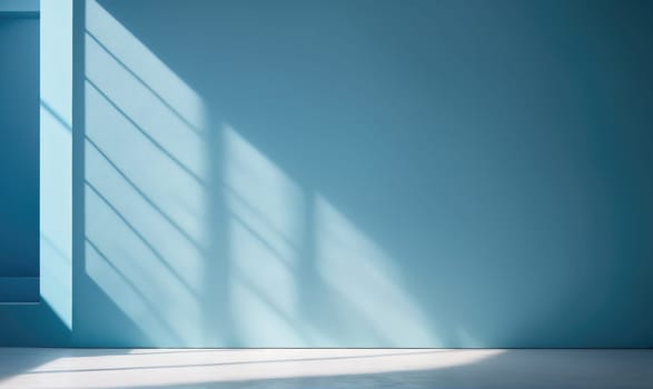 A wide shot of a blue wall with a white floor. Sunlight from a window shines through the room, creating a pattern of light and shadow on the wall.