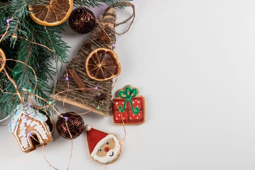 Christmas holiday neon color background with fir branches, toys garland and decorations. Xmas and Happy New Year theme. Flat lay, top view, space for text