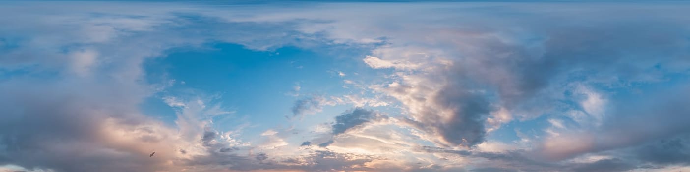 Bright sunset sky panorama with Cirrus clouds. Seamless hdr spherical equirectangular 360 panorama. Sky dome or zenith for 3D visualization, game and sky replacement for aerial drone 360 panoramas.