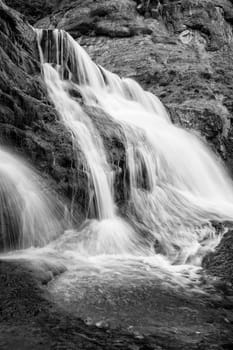 Big beautiful waterfall. Travel in Bulgaria. Hristovski waterfall. Vertical view