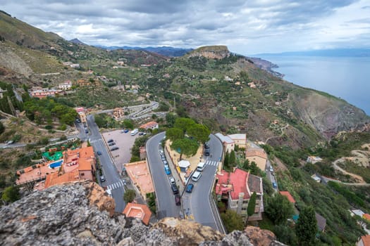 Stunning view of road curves and the Sicilian coast from Castelmola in Sicily, Italy