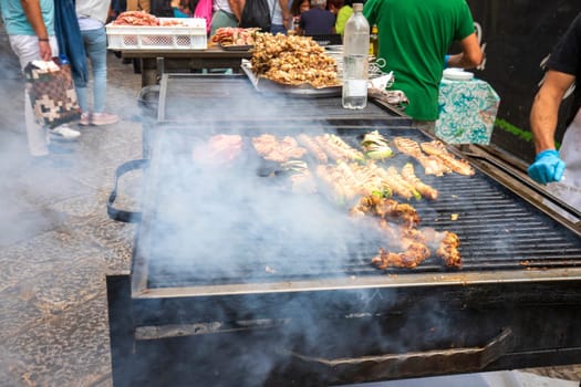 Street food, Meat on a barbecue grill with smoke. Close up