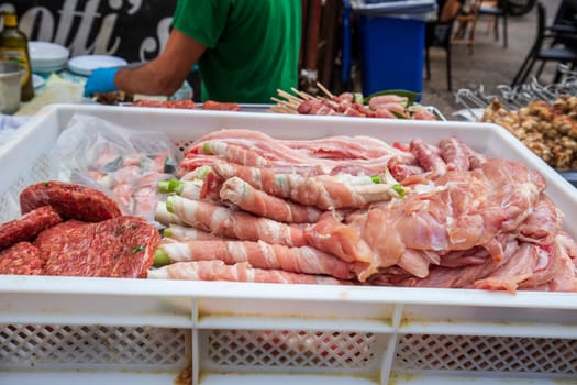Street food, fresh meat ready for barbecue grill. Close up
