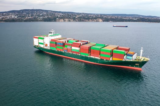 Aerial view of a container cargo ship on the sea. Cargo and shipping logistics business