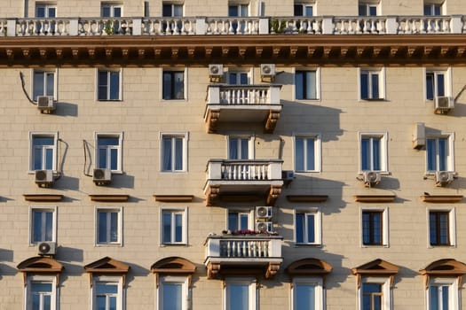 .Stalinist architecture buildings of USSR in Moscow, Russia. Facade with balconies and air conditioners
