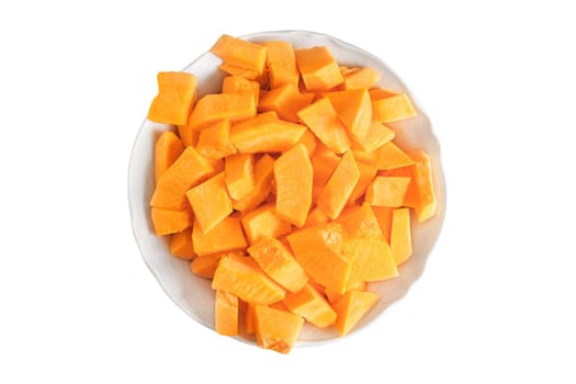 Fresh cut pumpkin slices on plate isolated on white background.