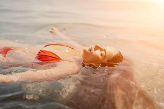 Happy woman sea relaxing floating in transparent sea water on summer holiday. Travel leisure recreation lifestyle, female in nature