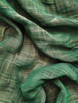 Close-up of a green fishing net with intricate patterns, showcasing the texture and folding technique used in its storage