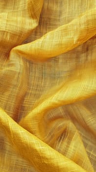 A close-up shot of golden yellow fabric with a distinctive textured weave, artfully draped to create dynamic waves and shadows
