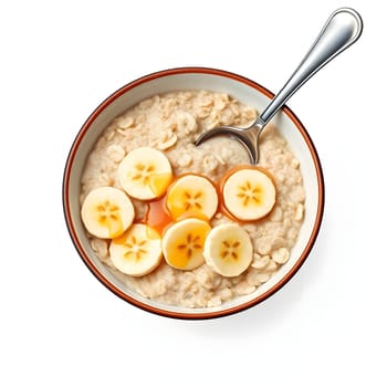 A hearty bowl of oatmeal is served with generous slices of ripe bananas on top, perfect for a nutritious breakfast. The warm dish is inviting and ready to enjoy at any time.