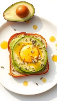 A beautifully presented avocado toast features slices of ripe avocado, an egg nestled in the center, and sunflower seeds sprinkled on top, with golden droplets of egg around it.
