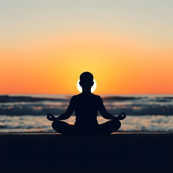 A person sits in a meditative pose on the beach, surrounded by gentle waves, as the sun sets on the horizon, creating a serene and tranquil atmosphere.