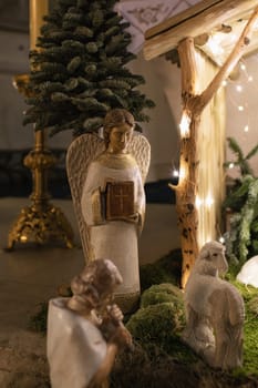 Angel with wings holds a bible in his hands Scene of the birth of Jesus Christ