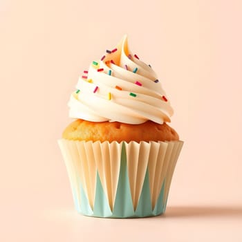 A freshly baked vanilla cupcake sits on a light background, adorned with smooth white frosting and vibrant sprinkles. Its fluffy texture and inviting look make it a tempting treat.