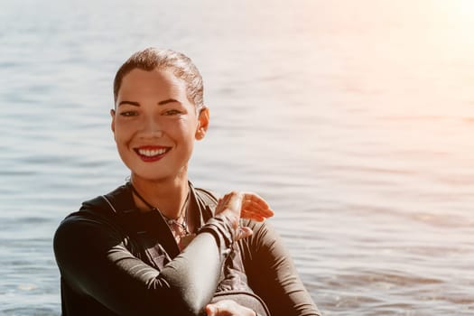 Happy smiling woman in kayak on ocean, paddling with wooden oar. Calm sea water and horizon in background