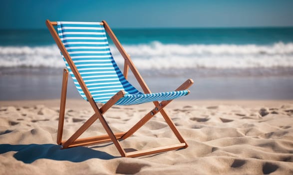 A wooden beach chair with a blue and white striped fabric seat is positioned on a sandy beach. The ocean with foamy waves is in the background.