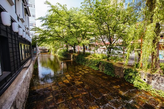 KYOTO, JAPAN - MAY 16, 2019: Beautiful traditional streetscape around Shirakawa Lane during the day in Higashiyama district in Kyoto, Japan
