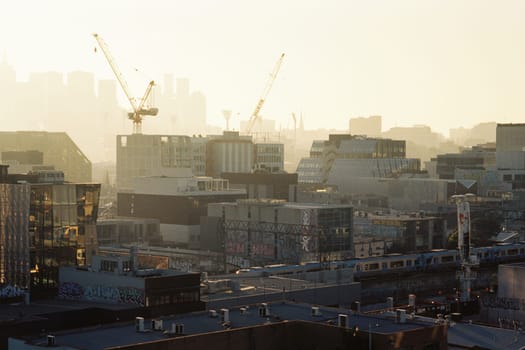 MELBOURNE, AUSTRALIA - JULY 31, 2024: View towards Melbourne skyline from a high rise building in Cremorne on a cold winter's afternoon in Australia. Shot with analogue film.
