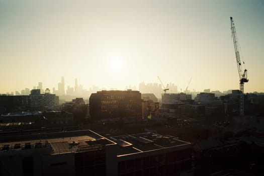 MELBOURNE, AUSTRALIA - JULY 31, 2024: View towards Melbourne skyline from a high rise building in Cremorne on a cold winter's afternoon in Australia. Shot with analogue film.