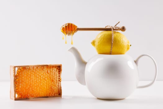 honey spoon with spilled honey on white background, top view, honey benefits concept