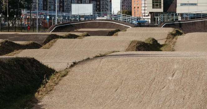 Empty BMX Race made from soil and sand. Adrenaline-Pumping Dirt BMX Race Track: A Rider's Paradise for Stunts and Speed. Extreme sport, bicycling concept