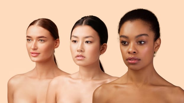 Portrait Of Three Beautiful Diverse Girls Posing Standing Over White Studio Background. Beauty And Body Care Concept. Panorama, Isolated
