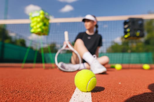 tennis ball close-up on the background of the court on the framed background of the girls tennis players, the concept of big tennis