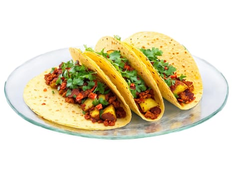 Chorizo and Potato Tacos with crispy potatoes and spicy chorizo served on a transparent glass. Food isolated on transparent background.