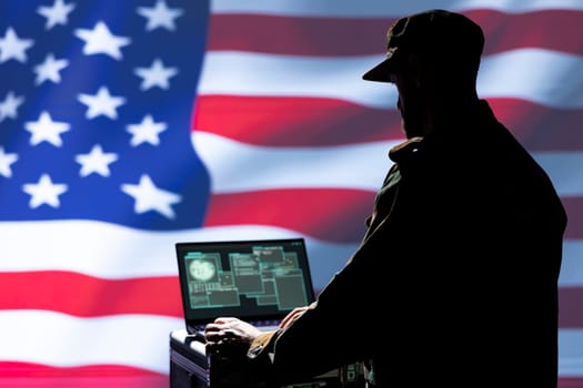 Laptop in CIA command center used by counterterrorism agents to run surveillance efforts against enemy of United States in conformity with Patriot Act law, isolated over USA flag