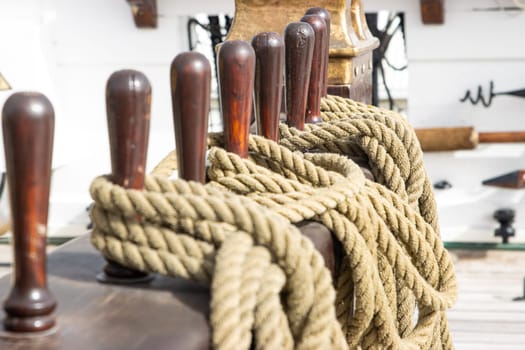 Ship's tackle on the deck of battle ship - ropes - military historical vessel, daylight