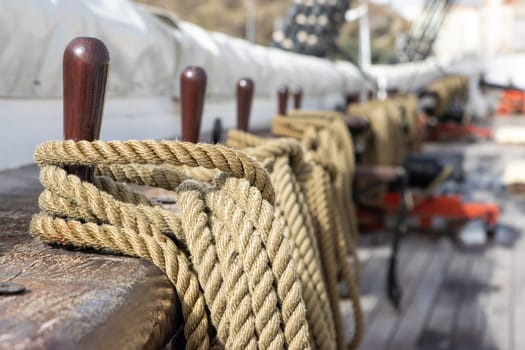 Ship's tackle in a battle ship - ropes on the deck - military historical vessel, daylight