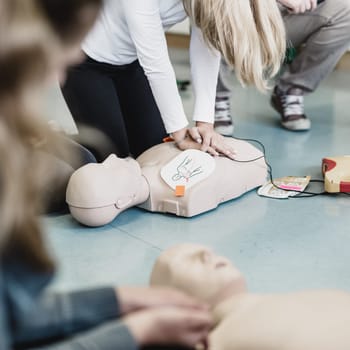 First aid cardiopulmonary resuscitation course using automated external defibrillator device, AED.