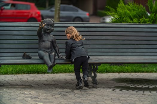 little girl playing in the square