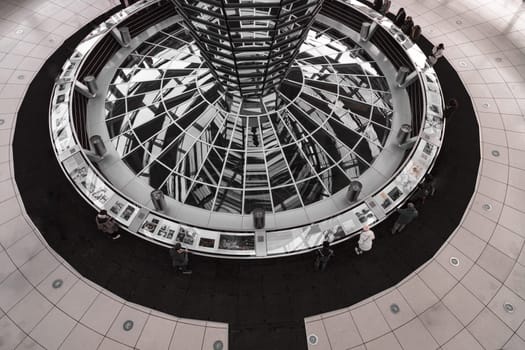 Berlin, Germany - Dec 20, 2023 - Architecture interior of the Cupola of the Reichstag dome is a glass dome constructed on top of the rebuilt Reichstag building. a major tourist attraction of the berlin city, Space for text, Selective focus.