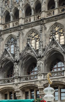 Munich, Germany - Dec 21, 2023 - Exterior architecture design details of famous New Town Hall (Neue Rathaus) on Marienplatz square in Munich. Gothic architectural style. Copy space, Selective focus.