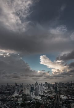 Bangkok, Thailand - 04 Aug 2024 - Aerial view of skyscrapers and dramatic sky before sunset. Beautiful clouds in the sky over large metropolitan city of bangkok, Copy space, Selective focus.