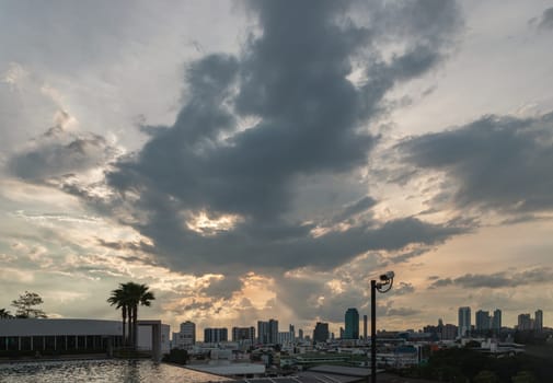 Bangkok, Thailand - 06 Aug 2024 - View of skyscrapers and dramatic sky before sunset. Beautiful clouds in the sky over large metropolitan city of bangkok, Copy space, Selective focus.