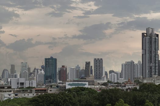 Bangkok, Thailand - 14 Aug, 2024 - Architecture exterior of Modern high-rise buildings of Dramatic sky in the city of Bangkok. Picturesque view of skyscrapers before Sunset, Space for text, Selective focus.