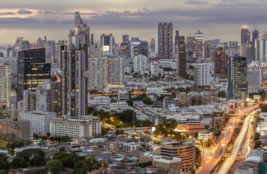 Bangkok, Thailand - 15 Aug 2024 - View of Beautiful Clouds in the Sky over Large Metropolitan City. Bangkok city skyscrapers after sunset with Dramatic sky background before Sunset, Space for text, Selective focus.