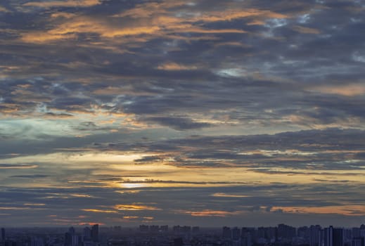 Colorful sunset and cloud sky background over Metropolitan. The skyscape is being covered with Amazing evening clouds like a heaven, Nature abstract composition for background wallpaper, textures and space for text, Selective focus.
