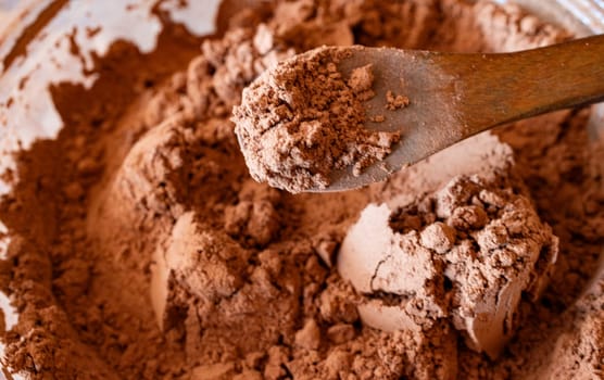 Bitter cocoa powder . Textured background. Copy space. Background for culinary promotions. Recipe magazines and cookbooks