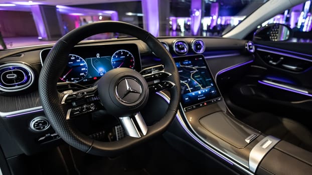 Kyiv, Ukraine - September 12: Mercedes-Benz luxury car interior showcasing the sleek design of the steering wheel, digital dashboard, and advanced navigation system